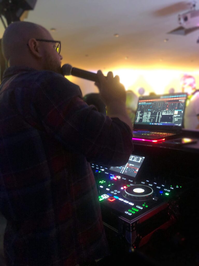 Photo of DJ Dano playing at evening reception